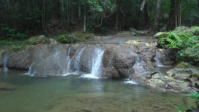 Sa Nang Manora waterfall in Phang Nga, Thailand, wonderful fresh water, small green waterfalls. Looks comfortable.