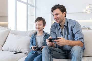 Father and son playing video game