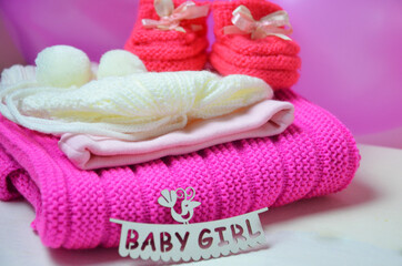 Baby girl knitted sandal, booties, shoes baby newborn, blank postcard. cocept it s a girl or baby shouer