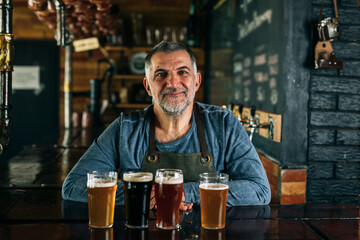 bartender offering a fresh beer in bar
