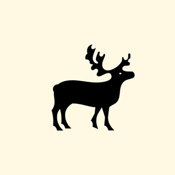 Reindeer logo with branched antlers. Logo. Emblem or symbol. Vector illustration. Flat design.