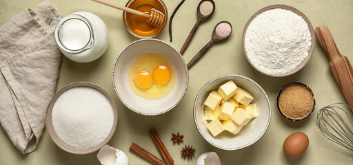 Baking background banner. Baking ingredients: flour, eggs, sugar, butter, milk and spices. Top view.