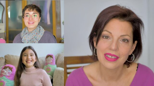 Madre conversa feliz con sus dos hijas mediante una videoconferencia
