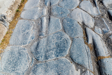 Street paving stones as background in Pompeii, Italy