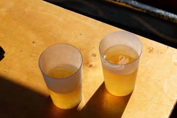  Beer in plastic glass with shadow