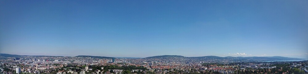 Fototapeta na wymiar Panorama of Zurich under a blue sky 