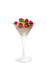 ice cream in martini glass with raspberry fruit and mint leaves on top. Isolated on white