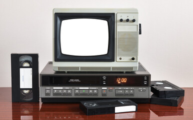 Obraz premium Old silver vintage TV with white screen to add new images to the screen, VCR on the background of wallpaper. 