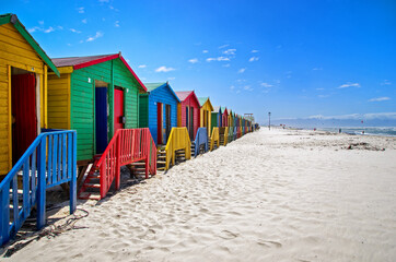 Row of a beach huts at Muizenberg Beach, Cape Town, South Africa. Colorful huts on the beach.