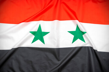 Fabric national flag of Syria as background