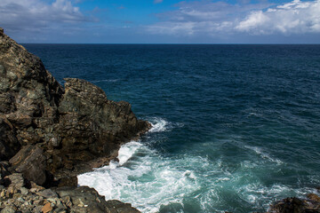 Fototapeta na wymiar Raging sea beating against the rocks at Chichiriviche de la Costa