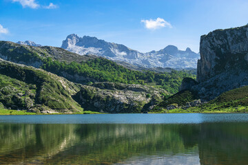 Naklejka na ściany i meble Beautiful view over Lake Ercina and the mountain ranges of the Picos de Europa. Photograph taken in the Picos de Europa, Asturias, Spain. 