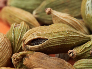 Dry organic Cardamom or Elakka top view background or texture. Healthy spices, nuts, seeds and herbal products.