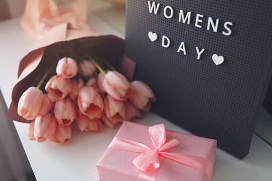 Pink tulips flowers and gift or present box pink background. , Womens Day, celebration concept