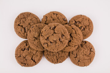 chocolate chip cookies with chocolate pieces on white background
