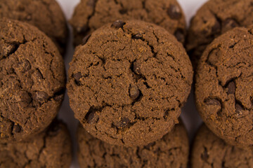 chocolate chip cookies with chocolate pieces on white background