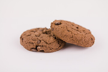 chocolate chip cookies with chocolate pieces on white background
