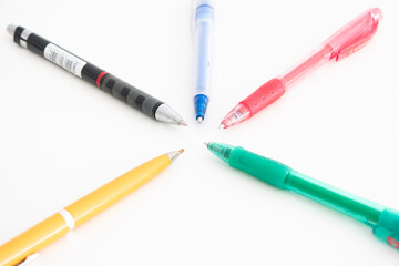 Variety of colorful ball pens top view studio shot isolated on white background