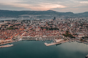 Aerial drone shot of Diocletian Palace with lights in Split old town with lights before sunrise in Croatia