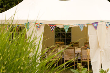 A summer tent or marquee set for a garden lunch party. © Hugh