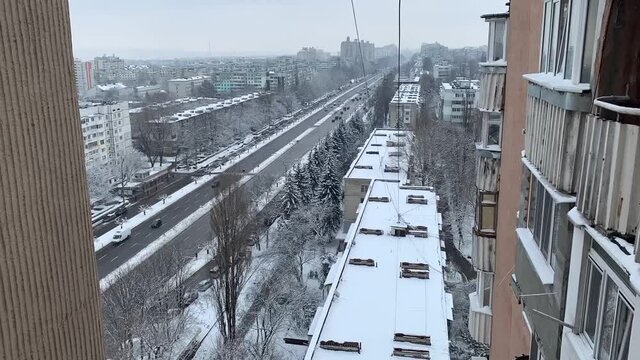 Aerial top view of a city road with traffic in Chisinau, Moldova in winter
