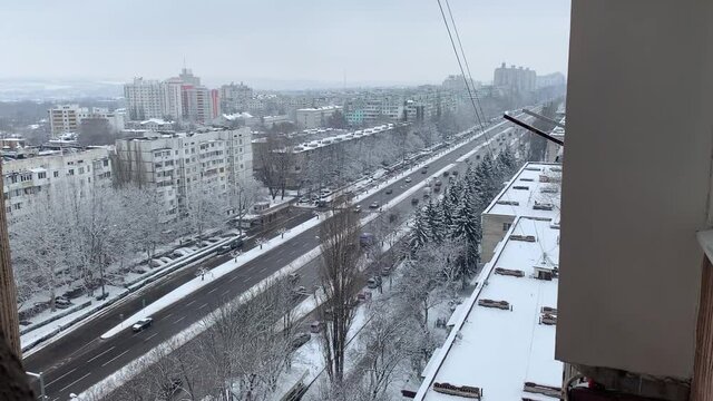 Aerial top view of a city road with traffic in Chisinau, Moldova in winter