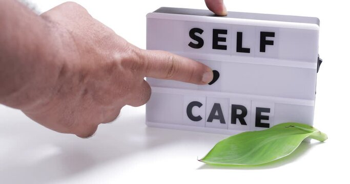 self care,   words on lightbox on white background flat lay. 