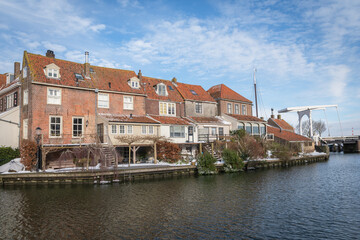 Scenic view of old Dutch houses on the canal in winter