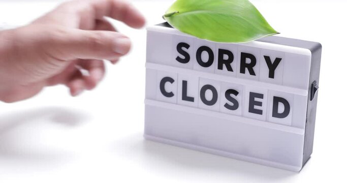 sorry closed,   words on lightbox on white background flat lay. 