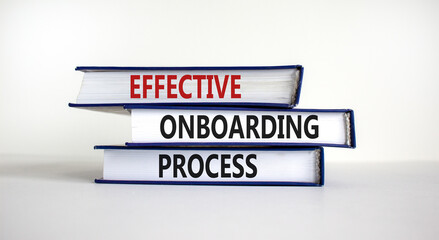 Effective onboarding process symbol. Books with words 'effective onboarding process' on beautiful...