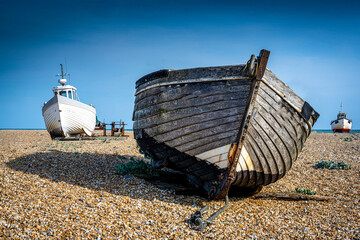 Fototapeta na wymiar Abandoned fishing boat on the beach