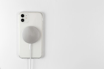 wireless magnetic charger for your phone. white background
