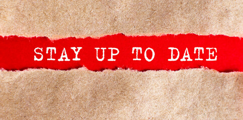 STAY UP TO DATE word written under torn paper.