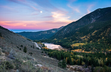 Autumn sunset in the rocky mountains with a small lake
