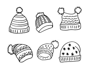 A set of warm winter hats with pom-poms. Doodle style. Hand drawn vector illustration on white background in black outline. Cozy winter warm clothes.