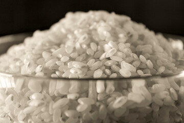 White rice texture and background in glass bowl