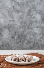Cookies in a white plate on the blended coffee powder