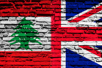 Flag of Lebanon and England on brick wall