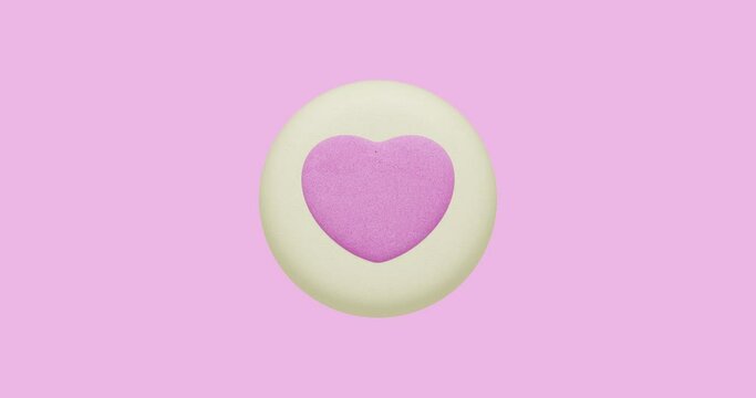 Minimal motion design. 3d creative pink cookies heart at plate moves in pink abstract space. Sweet, candy,party shop, birthday party, valentines day, greatings concept 4k video
