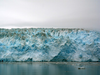 Alaska gorgeous and vivid blue icy glacier close up.