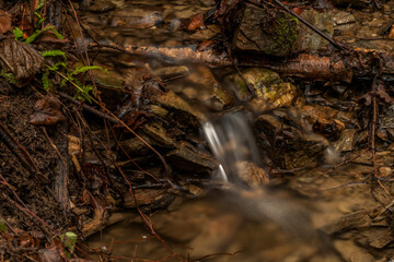 Small creek near Malse river with Doudlebsky waterfall in cold winter color day