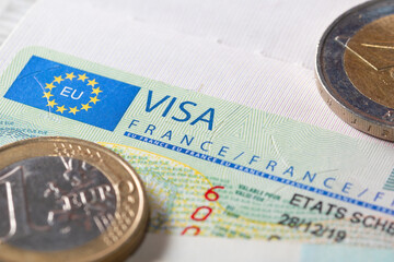 Schengen visa in passport. This sample of the Schengen visa has been put into circulation since 2019.  Issued by the French embassy. Selective focus.