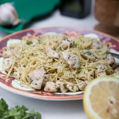 Angel hair pasta dish with chicken lemon parsley 