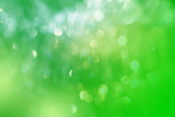 Natural green blurred background. Green bokeh, defocused lights. Abstract blur background.