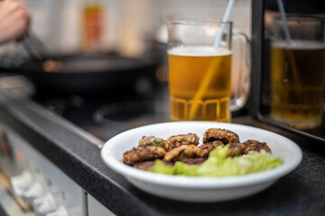 woman preparing mini hamburger over the kitchen table