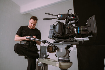 Director of photography with a camera in his hands on the set.