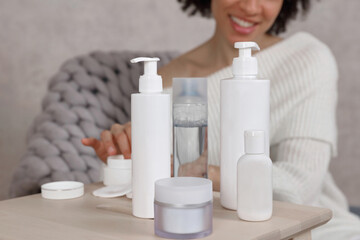Woman applying moisturizing cream.Beauty routine at home. Selective focus on Skin care Products,copy space