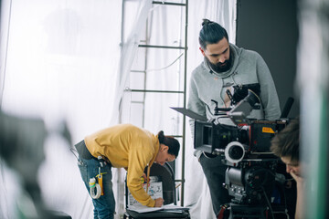 Director of photography with a camera in his hands on the set.