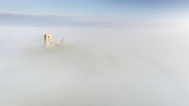 Burrow Mump Church surrounded by morning mist in winter, Burrowbridge, Somerset