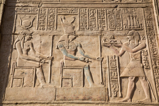 Gods Hathor on left and Haroeris in centre with Pharaoh on the right, Wall Reliefs, Temple of Sobek and Haroeris, Kom Ombo, Egypt